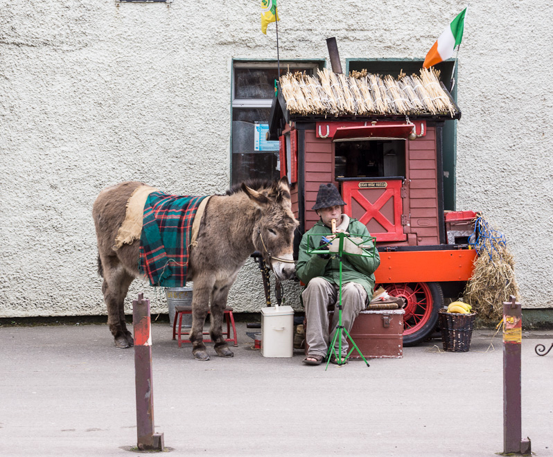Donkey, Cart, and Man with Flute
